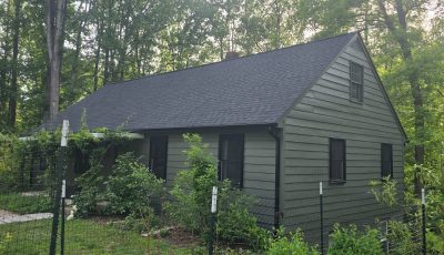 front corner view of house with painted siding