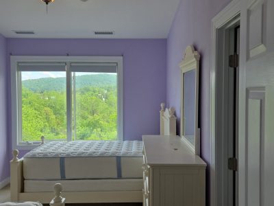 bedroom with light purple painted walls
