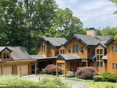 wood siding home and garage