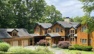 wood siding home and garage