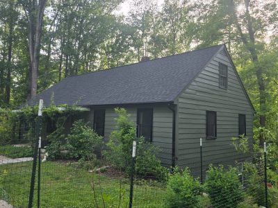 front corner view of house with painted siding