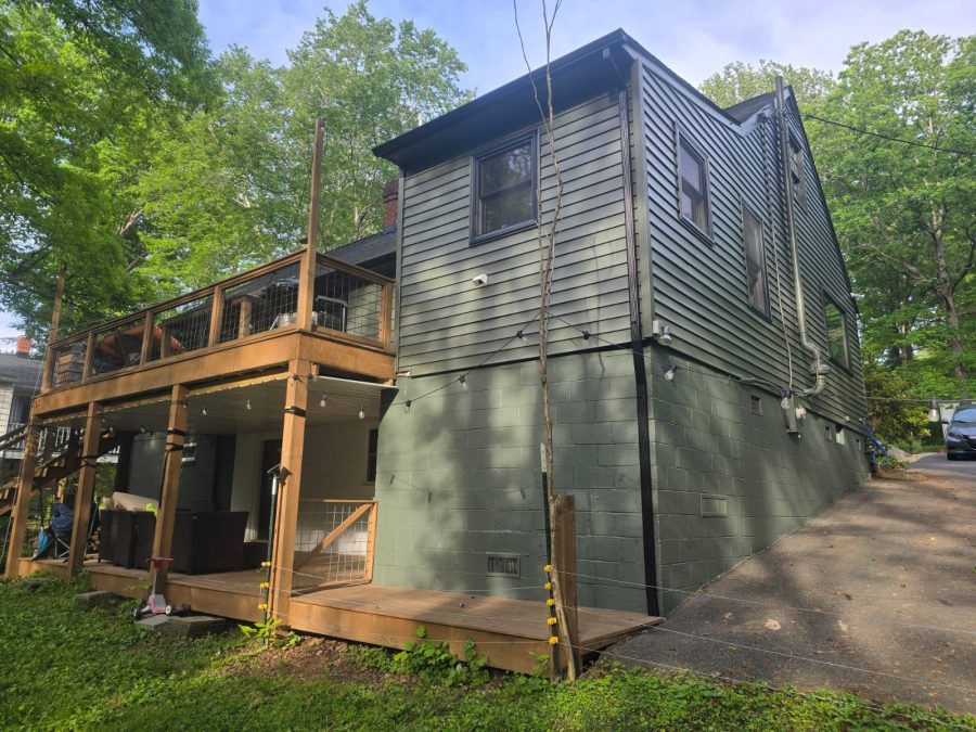 rear view of house with painted siding and brick Preview Image 2