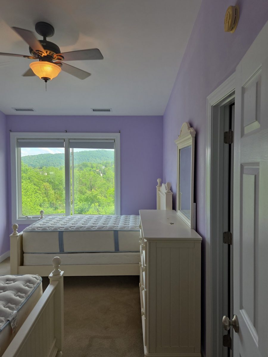 bedroom with light purple painted walls