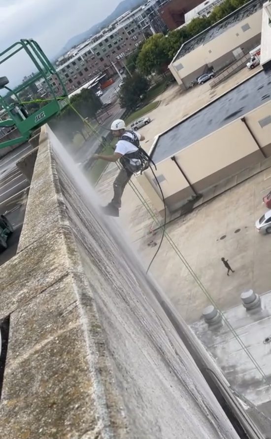 Chattanooga Convention Center Parking Garage - Worker power washing