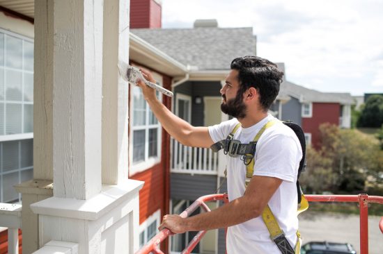 Painter working with a lift