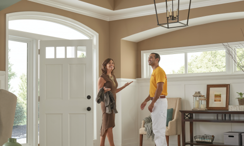 CertaPro painting crew member showing work to a customer