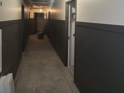 freshly painted gray and white walls in apartment complex hallway on Broadway Chicago IL