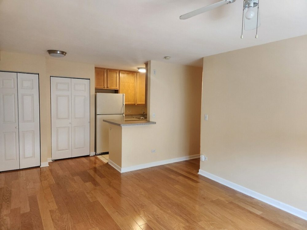 beige and white painted condo interior living room