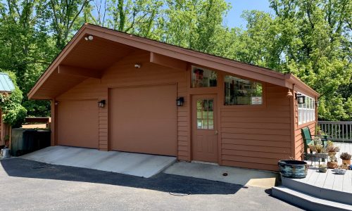 Repaired, Stained and Painted Garages and Siding