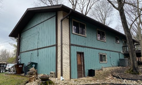 Side of Home Before Painting