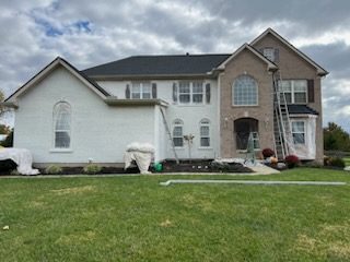 brick home in process of being painted Preview Image 16