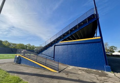 painted high school football stadium seating stands | side view
