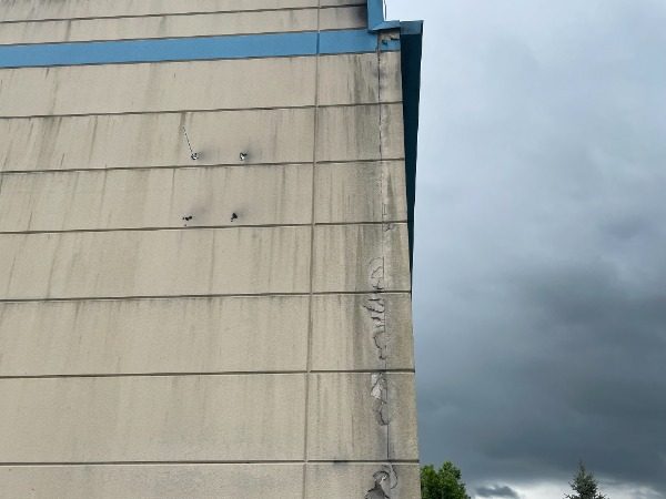 Commercial Exterior Painting Project Before Photo in Florence Kentucky. View of extensive damage on the side of building to roof. Preview Image 3