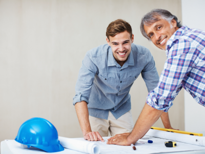 Two men communcating over plans