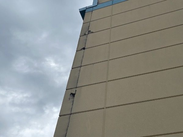 Commercial Exterior Painting Project Before Photo in Florence Kentucky. View of side wall looking up. Preview Image 1