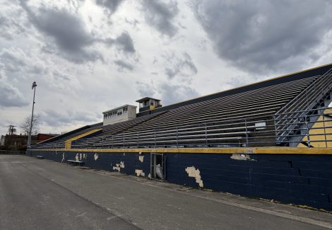 high school stadium stand with damaged paint
