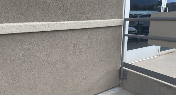 fully repaired stucco wall on healthcare facility