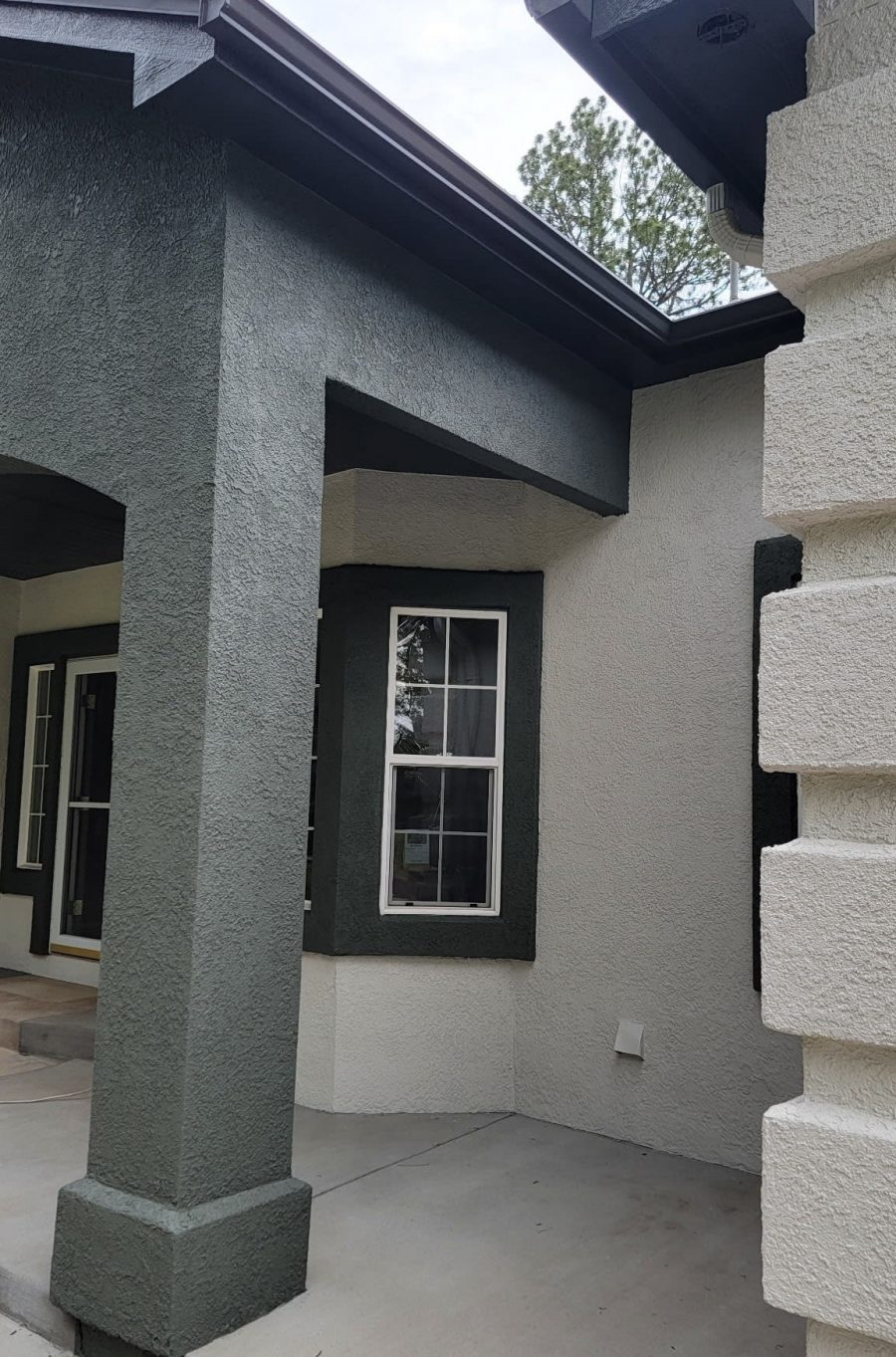 two tone painted stucco covered front porch Preview Image 3