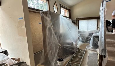 house interior with paint prep coverings