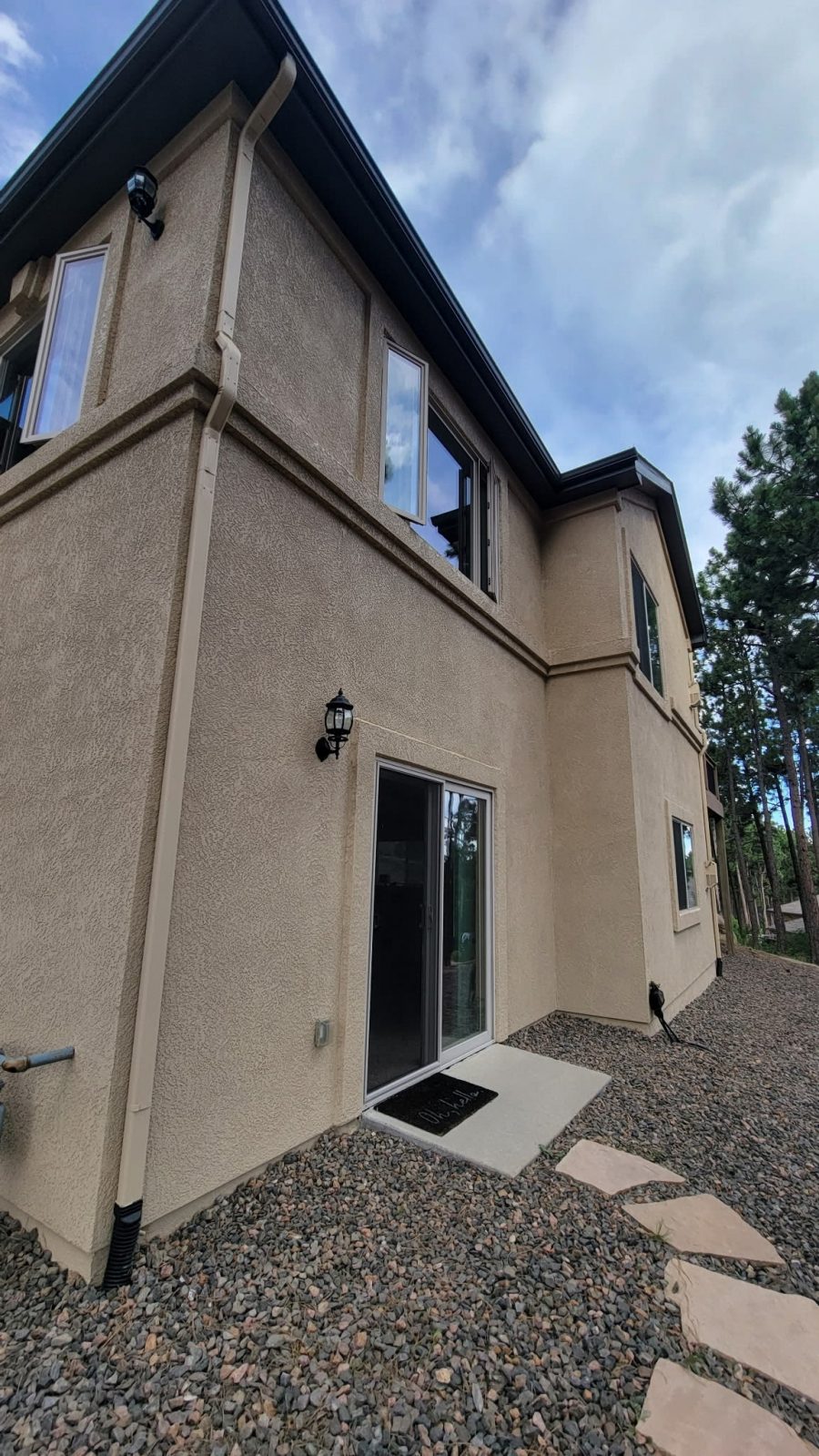 glass patio door on tan painted stucco house exterior Preview Image 5