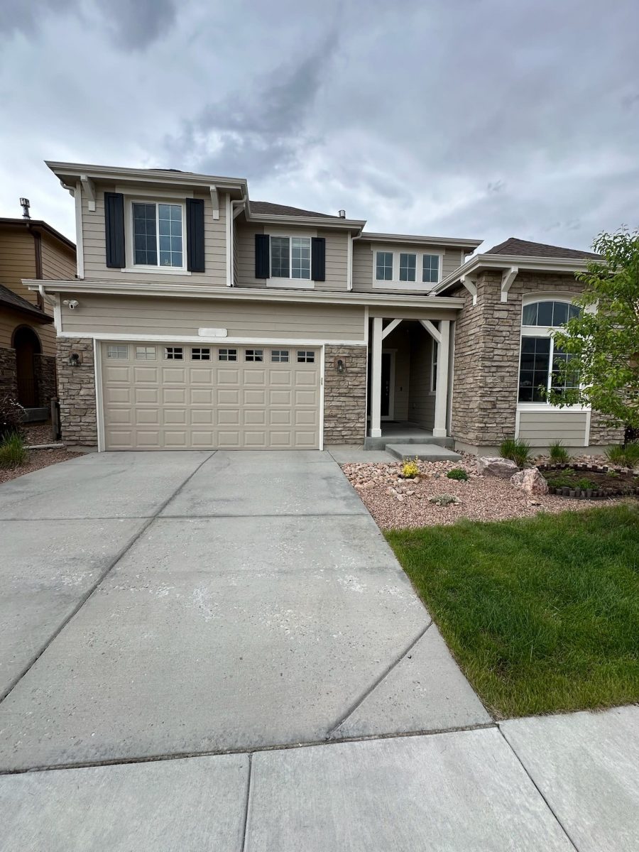 driveway and garage door on front side of house