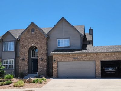 front of house with brick and siding