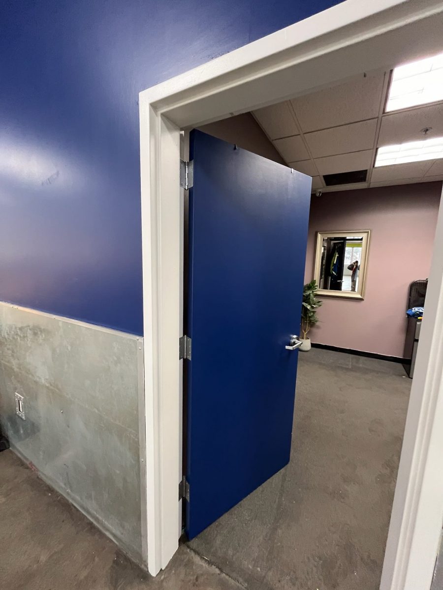 blue painted wall and door in Goodwill commercial space Preview Image 4