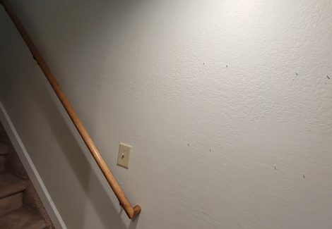 white painted staircase wall