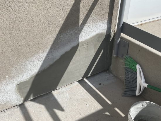 stucco repair on healthcare facility during painting process