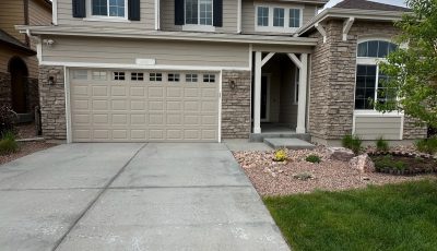 driveway and garage door on front side of house