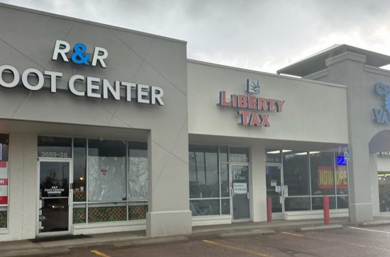 painted stucco storefronts of outdoor shopping center