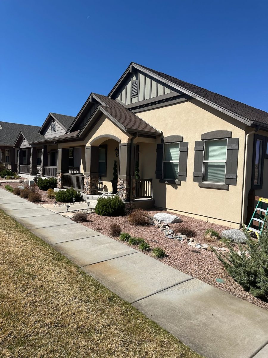 front of home with painted stucco siding