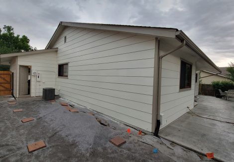 side of house with white painted siding