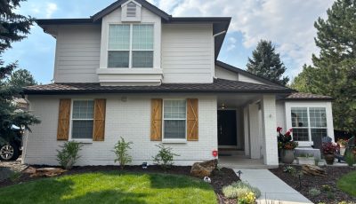 home with stained wooden shutters