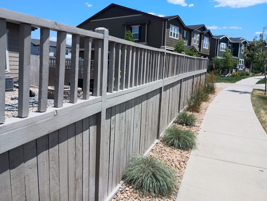 stained wooden fence surrounding home