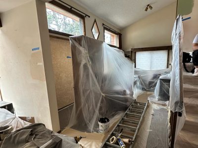house interior with paint prep coverings