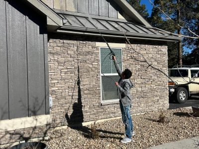 man power washing house