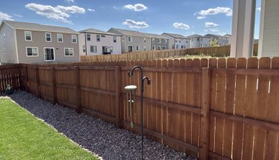 stained wooden fence surrounding yard