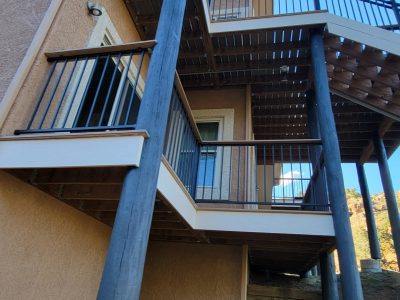 blue painted support beams outside home