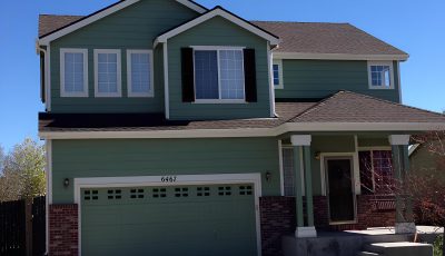 Two Story Green Exterior in Stetson Hills, CO