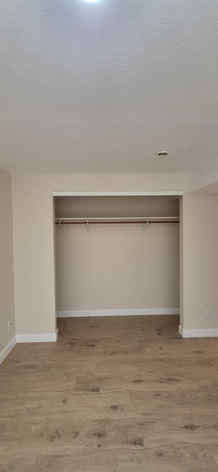 beige painted room interior and closet Preview Image 2