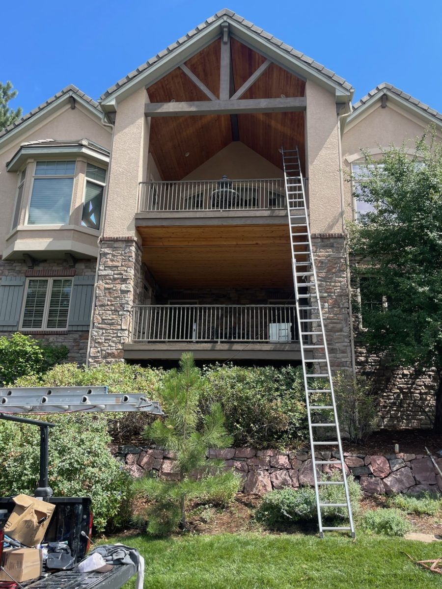 mountain style two story home with vaulted balcony ceiling