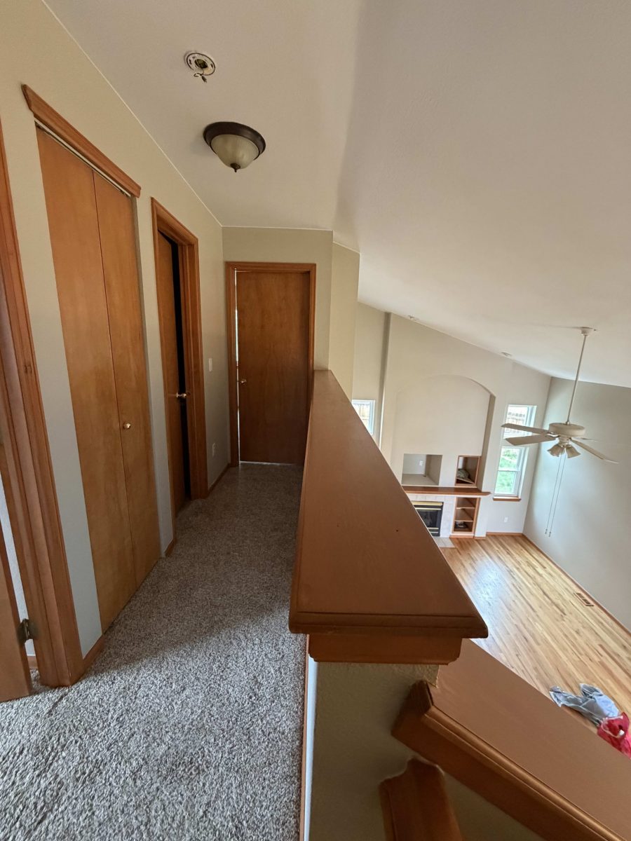 white painted house interior with stained wooden doors and trim Preview Image 5