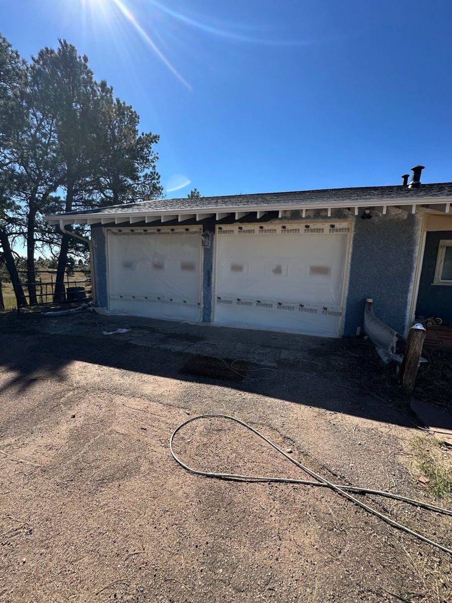 garage side of stucco home during repaint Preview Image 2