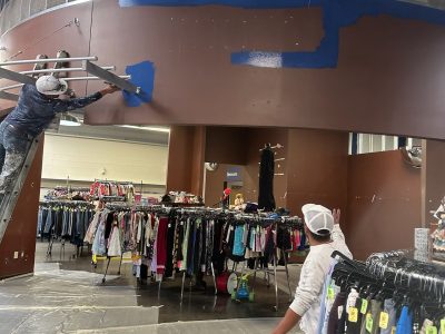 painters working on retail interior walls