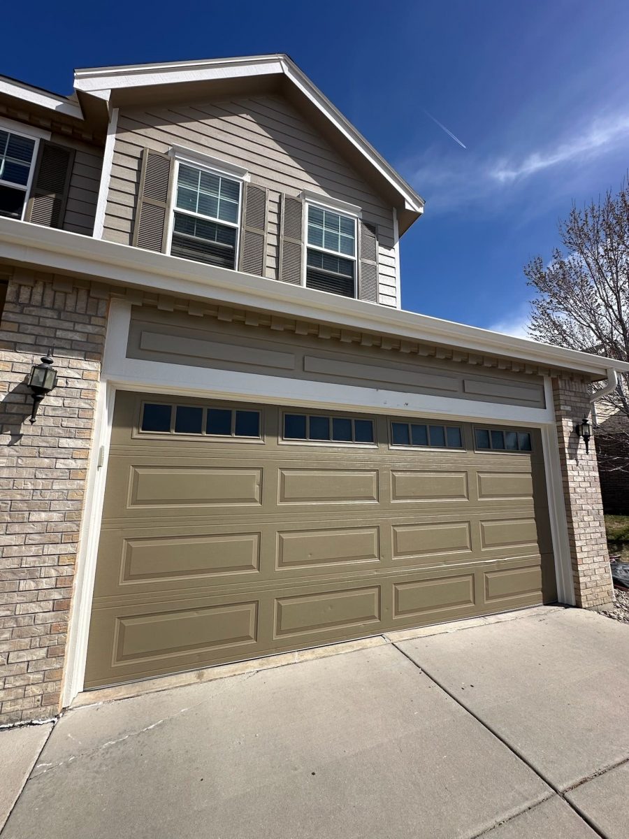 house exterior with painted garage and shutters
