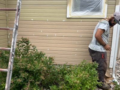 exterior wall with siding repair in progress