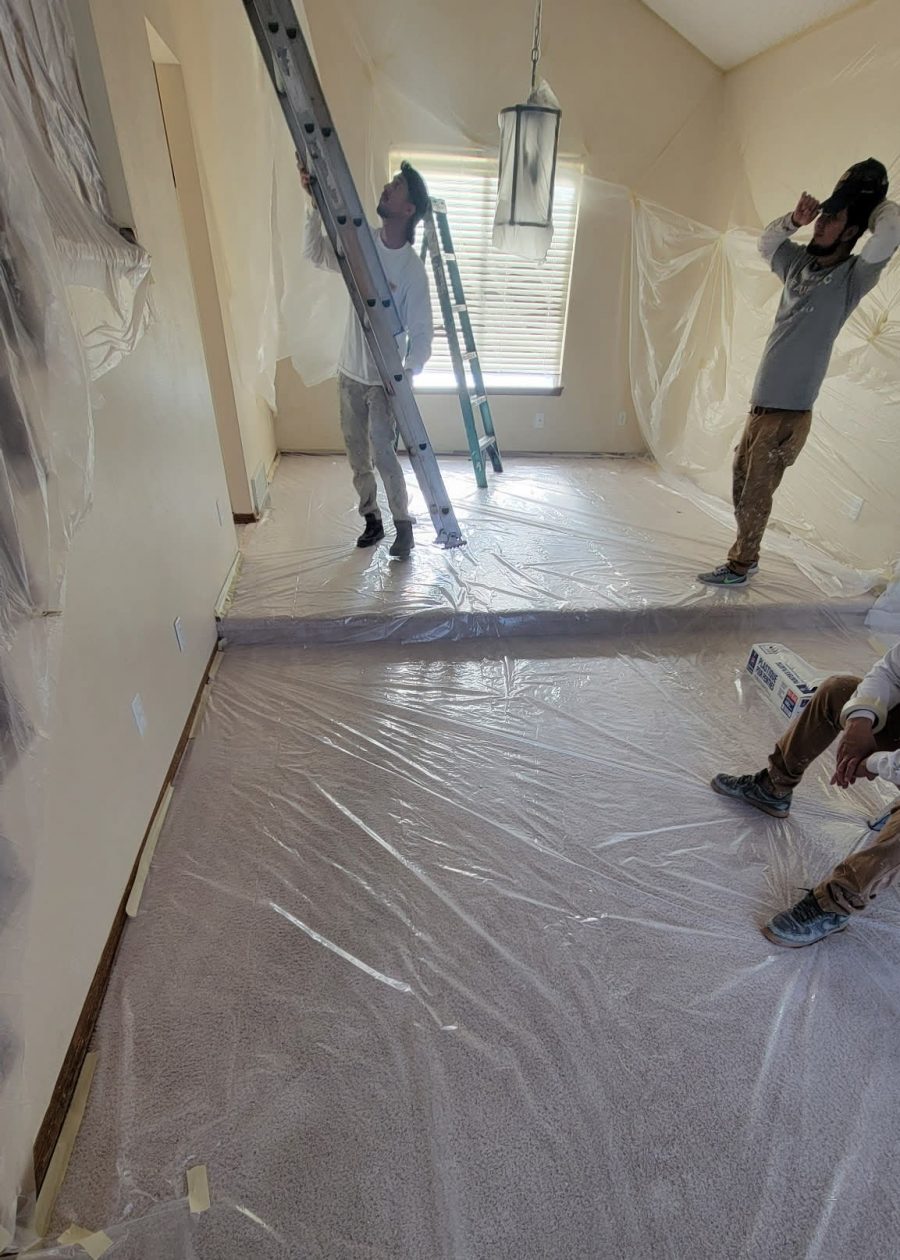 home interior with plastic sheeting during painting Preview Image 2