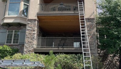 mountain style two story home with vaulted balcony ceiling