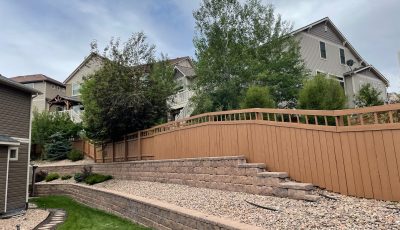 painted fence surrounding house and yard